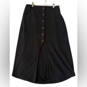 Anthropologie Maeve stretch polyester midi black skirt,half open at front.Size L